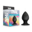 A box by Anal Adventures stands against a white backdrop next to a black silicone buttplug.