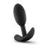 A black silicone butt plug stands against a white backdrop and showcases its curved t-bar base.