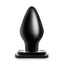 A black PVC anal plug stands against a white backdrop and showcases its tapered, rounded tip.