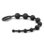 Black anal beads lay flat against a white backdrop with a flexible design. 