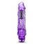 A clear purple vibrator stands against a white backdrop with a ridged phallic head. 