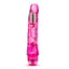 A clear pink waterproof vibrator stands against a white backdrop with a twist dial on the base.