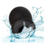 A black silicone rechargeable vibrating FTM stroker is shown in water to showcase its waterproof properties.