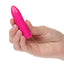 A hand model holds a mini pink bullet vibrator to showcase its scale.