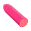 A pink mini bullet vibrator lays flat and showcases its base with an easy push-button control. 