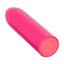 A classic pink bullet vibrator lays flat and showcases its single push-button on the base.