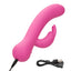 A pink turbo rabbit vibrator lays flat and showcases its charging cord connected to the base.