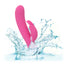 A pink turbo rabbit vibrator is shown splashing in water to showcase its waterproof properties.