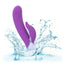 A purple turbo rabbit vibrator is shown splashing in water to showcase its waterproof properties.