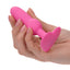 A hand model holds a pink vibrating beaded anal probe for scale.