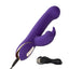 A purple silicone rabbit vibrator lays flat on its side and showcases its charging cord attached to the base.