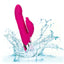 A pink rabbit thrusting vibrator splashes in water showcasing its waterproof design. 