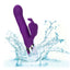 a purple thrusting rabbit vibrator with rotating beads splashes in water showcasing its waterproof design. 