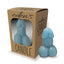 A blue phallic shaped candle stands next to its package by Little Genie Productions.