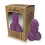 A purple phallic shaped candle stands next to its package by Little Genie Productions.