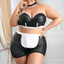 A curvy model wears a maid costume with a wet look strapless bustier and apron skirt.