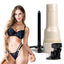 A Fleshlight Girls Sky Bri star stands holding a textured vaginal masturbator next to its warming stand, iridescent hard shell case and shower mount. 