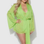 A plus size model wears a sheer green chiffon robe with lace trim around the sleeves. 