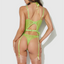 Back view of a model wearing a green sheer lace gartered bustier set with adjustable shoulder and garter straps.