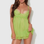 A model wears a sheer green chiffon babydoll and thong with scalloped lace upper cup and hem details. 