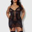 A plus size model wears a black chemise with matching thong featuring sheer mesh and satin microfibre panels.