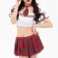 A model wears an off-shoulder red and white school girl costume with a pleated plaid skirt. 