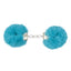 A pair of handcuffs lay on a white backdrop with blue fluffy faux fur on each cuff.