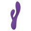 A purple silicone rabbit vibrator with an ergonomically curved shaft stands against a white backdrop. 