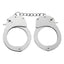 A pair of metal handcuffs lay flat on a white backdrop with a chain connecting the cuffs.