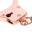 Close up of a rose gold metal handcuff showcasing its keyhole.