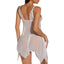 Back view of a lingerie model wearing a sheer white mesh and lace babydoll with a high-low hanky hem and tapered points.