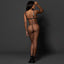 Back view of a model wearing a black faux leather cut-out strappy bra and black panty with a thong-like design. 