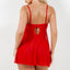 Back view of a model wearing a sheer red babydoll and g-string with adjustable shoulder straps. 