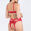 Back view of a model wearing a red strappy lace teddy with open rear with cage strap details. 