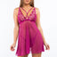 A model wears a magenta pink sheer mesh babydoll with scalloped floral motif around the v-neck.  