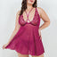 A curvy model wears a magenta pink sheer mesh babydoll with scalloped floral motif around the v-neck.  