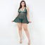 A curvy model wears a green sheer floral babydoll with o-ring detail in the middle of the bust.