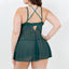 Back view of a curvy model wearing a green sheer babydoll with a g-string showcasing adjustable shoulder straps. 