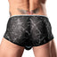 Back view of a model wearing a pair of mini briefs with a marble print and mesh material. 