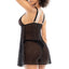 Back view of a model wearing a black sheer babydoll and panty with adjustable shoulder straps. 