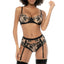 A model wears a nude mesh bra, garter and panty set with black floral embroidery and satin. 