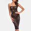 A model wears a sheer black lace corset-style back midi dress with a floral design. 