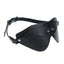 A black grainy faux leather blindfold with a dual-layered front design sits against a white backdrop. 