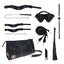 A BDSM bag in black faux leather includes a blindfold, ankle cuffs, wrist cuffs, collar & leash, bullet, flogger, ball gag and restraints. 