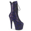 A platform ankle boot with a 7 inch stiletto heel stands against a white backdrop with a shimmery purple snake print finish.