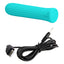 An aqua ribbed bullet vibrator lays next to its charging cord. 