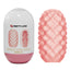 A Pretty Love double-sided pink textured egg stroker stands next to its egg-shaped case.