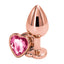 A pair of large rose gold metal butt plugs stands against a white backdrop showcasing its heart pink gem flared stopper. 