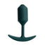 A small green weighted silicone easy-insert torpedo shaped small butt plug stands against a white backdrop. 