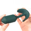 A hand model holds a weighted green anal plug showcasing its flexible t-bar.